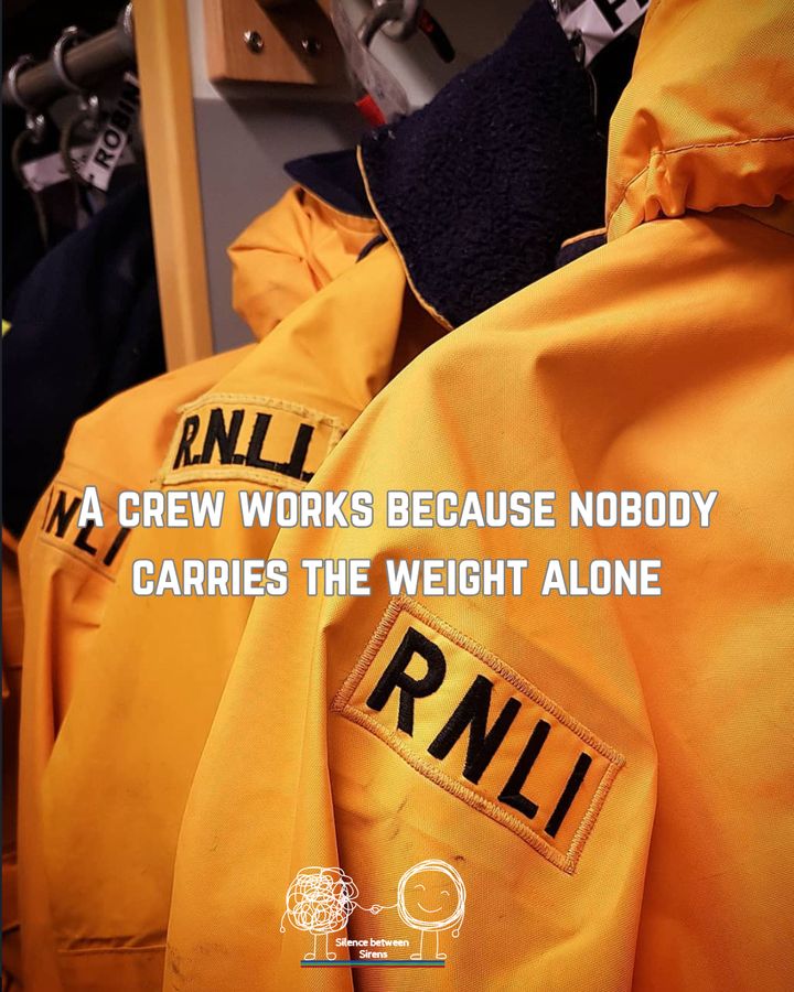 RNLI jackets on hooks with the words A crew works because nobody carries the weight alone